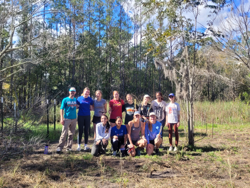 volunteers from the UF women's ultimate frisbee club